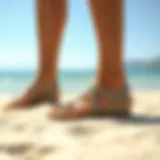 Stylish Summer Sandals Elegant summer sandals on a sandy beach