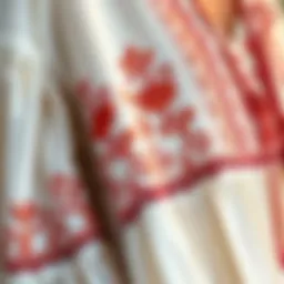 A close-up of intricate embroidery on a flowing bohemian dress