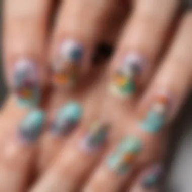 A close-up of applied cartoon nail art stickers on perfectly manicured nails