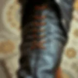 Close-up of lace-up detailing on leather pants