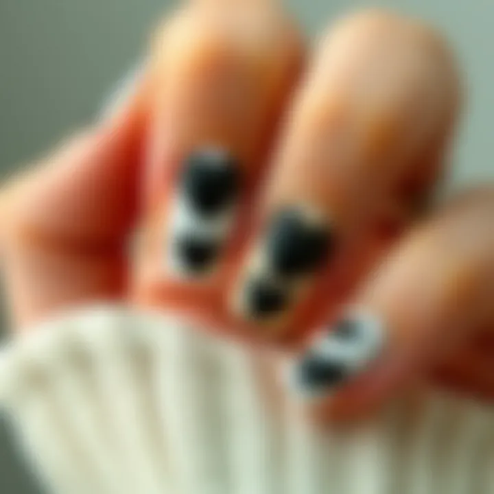 Chic Application of Black Heart Nail Stickers Stylish black heart nail stickers applied on manicured nails