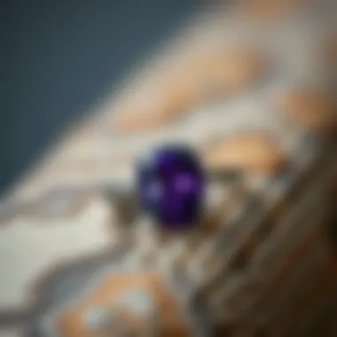 Craftsmanship of Amethyst Ring on Texture A beautifully crafted amethyst ring placed on a textured surface