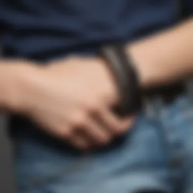 A fashionable individual sporting a coil wristband as an accessory in a casual outfit.