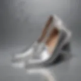 Stylish display of silver slip-on shoes against a trendy backdrop