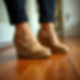 The Elegance of Wedge House Shoes Elegant wedge house shoes on a wooden floor