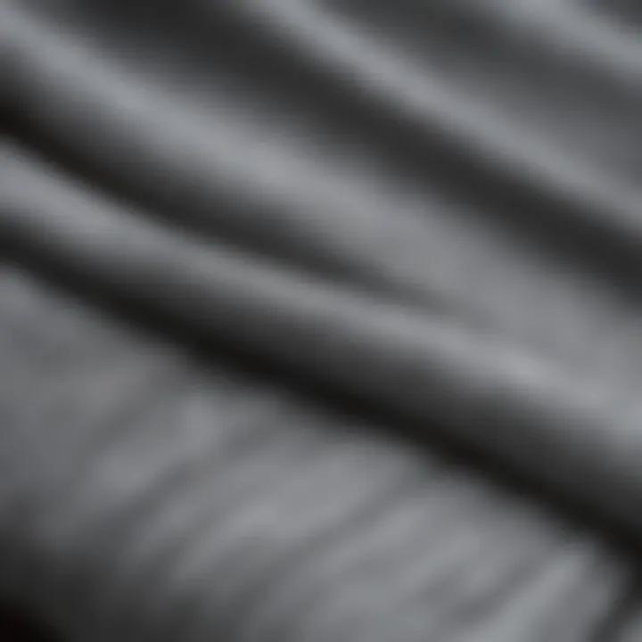 Close-up of innovative materials used in modern slimming sweatpants highlighting texture and flexibility.