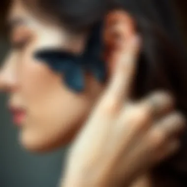 Styling with a Black Butterfly Hair Clip Close-up of a woman styling her hair with a black butterfly hair clip