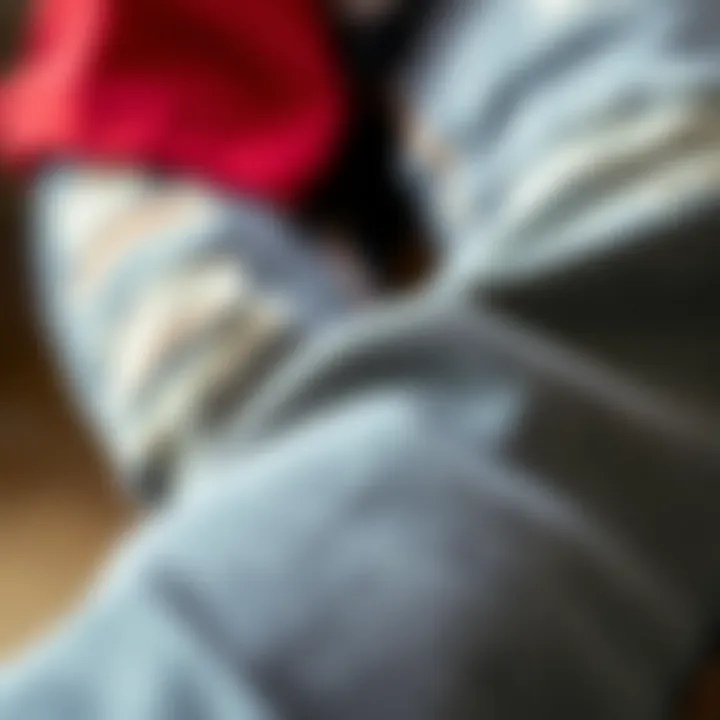 High-Quality Fabric of Grey Distressed Jeans Close-up of high-quality fabric of grey distressed jeans