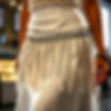 The Intricate Rhinestone Fringe of the White Skirt Elegant white skirt showcasing rhinestone fringe detail