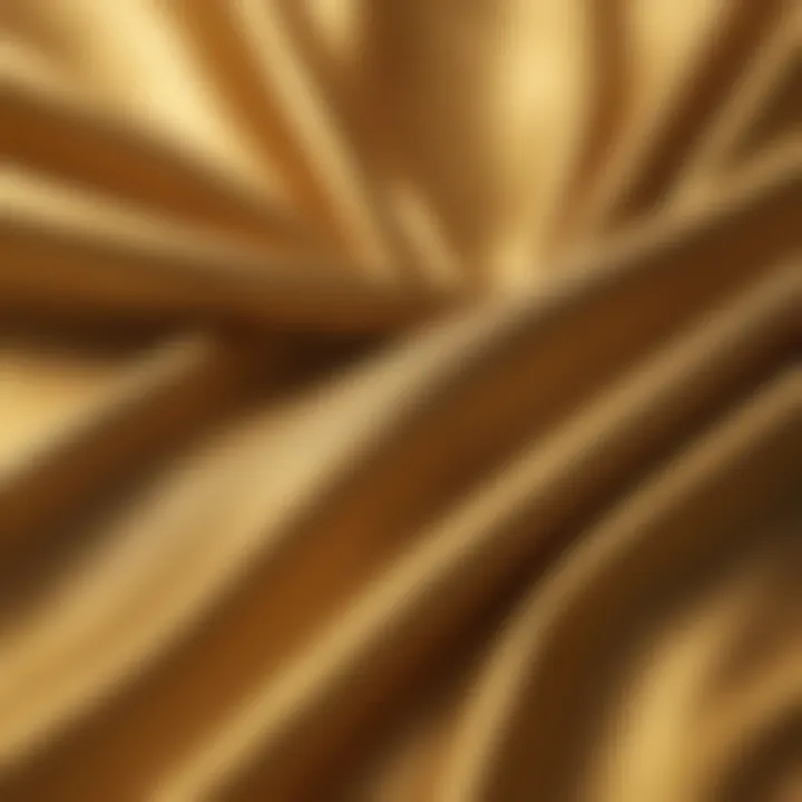 Close-up of fabric texture of a gold long sleeve blouse