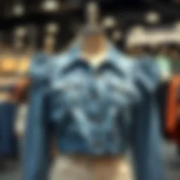 Stylish blue jean jacket with puff shoulders displayed on a mannequin