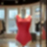 A stylish scoop neck unitard displayed on a mannequin in an elegant setting