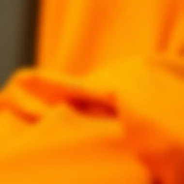 Fabric Focus: Quality and Richness of Orange Close-up of orange fabric texture highlighting its quality and richness.